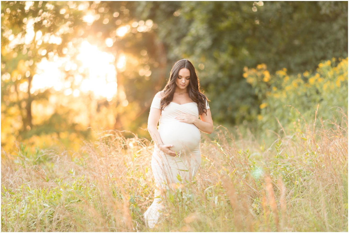 Woman in grassy field at sunset for maternity pictures at North Park in Pittsburgh