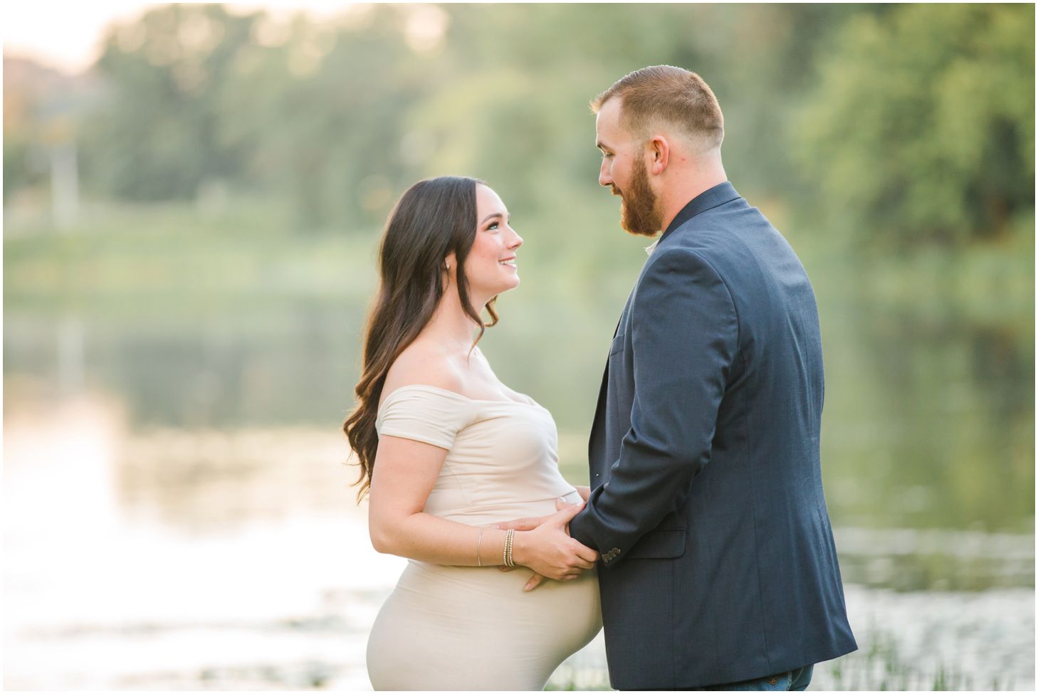Couple in front of lake for maternity pictures at North Park in Pittsburgh