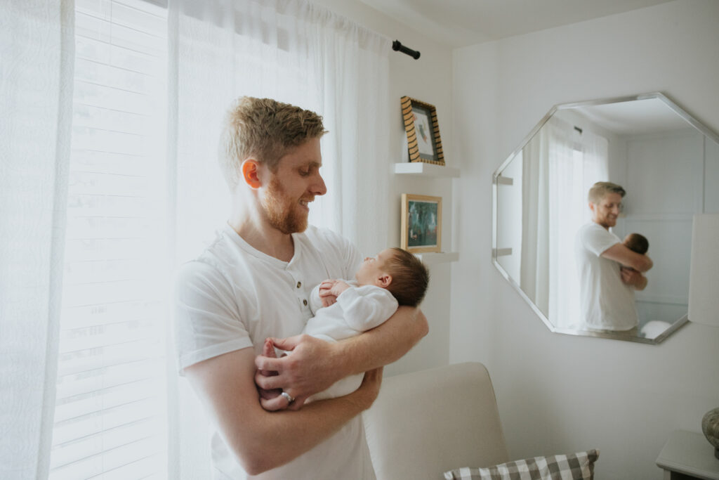 dad and newborn in nursery | Pittsburgh in-home newborn photographer
