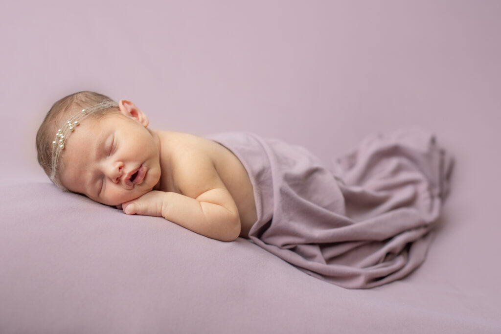 Newborn girl in purple at photography studio in Pittsburgh PA | Kelly Adrienne Photography