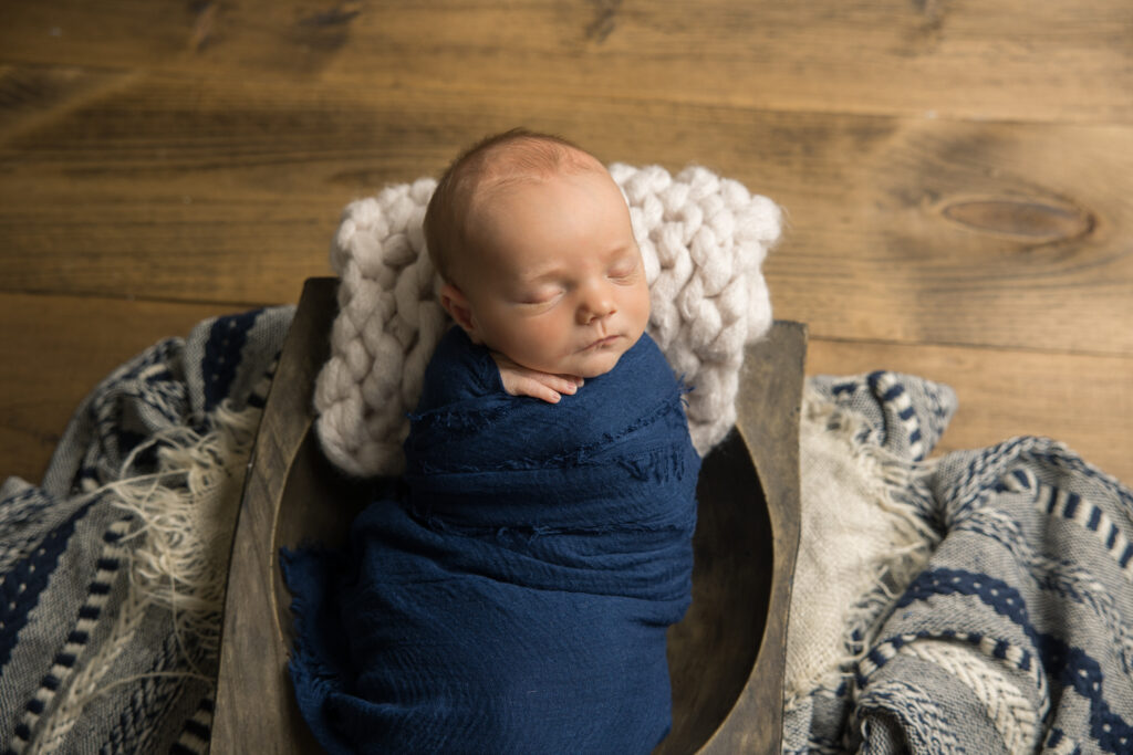 newborn baby boy with blue props | Pittsburgh newborn photography studio 