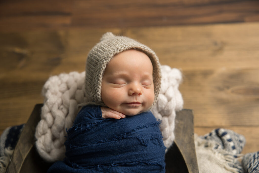 newborn baby boy with blue props | Pittsburgh newborn photography studio 
