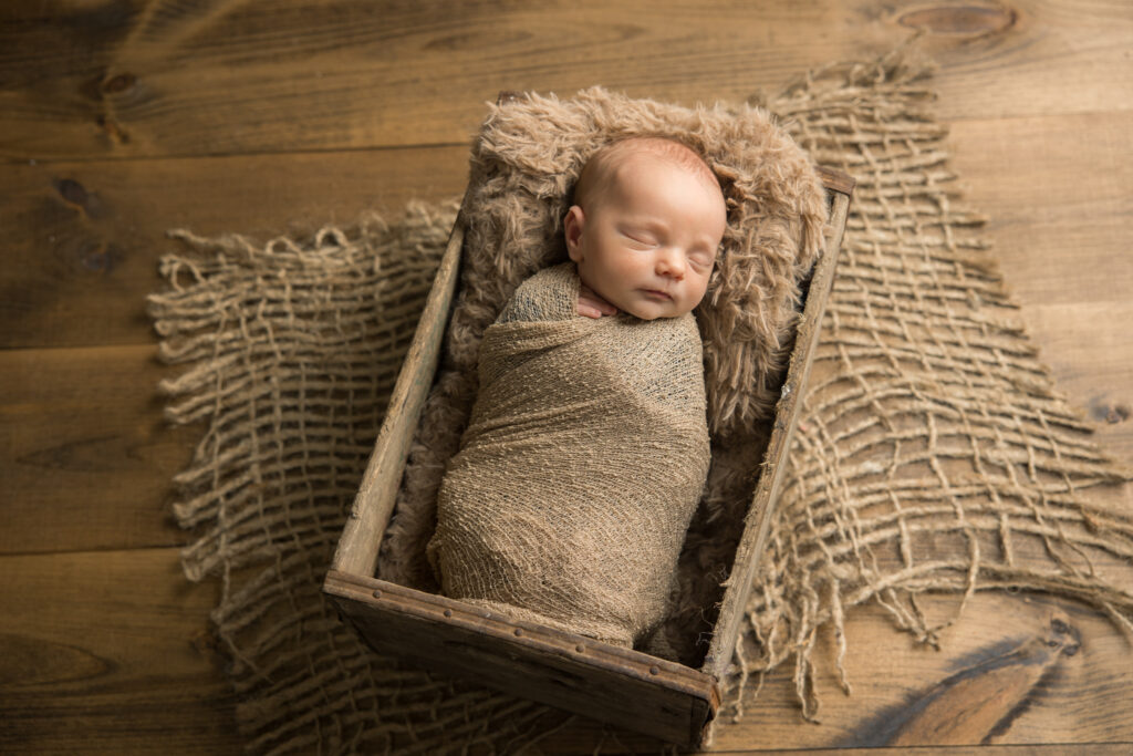newborn baby boy with beige props | Pittsburgh newborn photography studio 