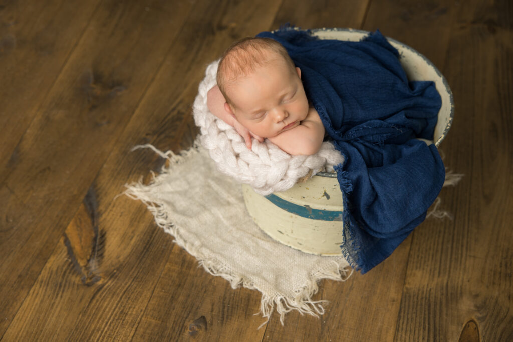 newborn baby boy in bucket | Pittsburgh newborn photography studio 