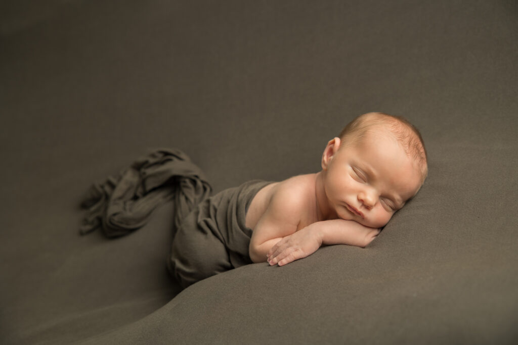 newborn baby boy on olive backdrop | Pittsburgh newborn photography studio 