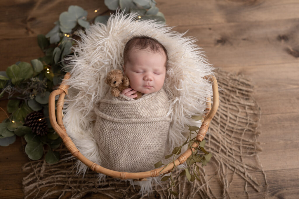 Newborn in basket with Christmas lights | Pittsburgh newborn photography studio