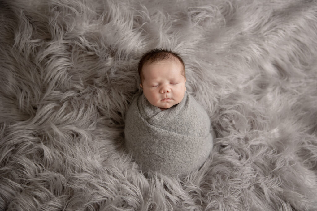 Newborn on gray fur | Pittsburgh newborn photography studio