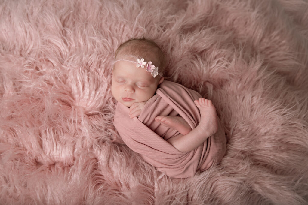 newborn girl on pink fur backdrop | Pittsburgh newborn photographers Kelly Adrienne Photography