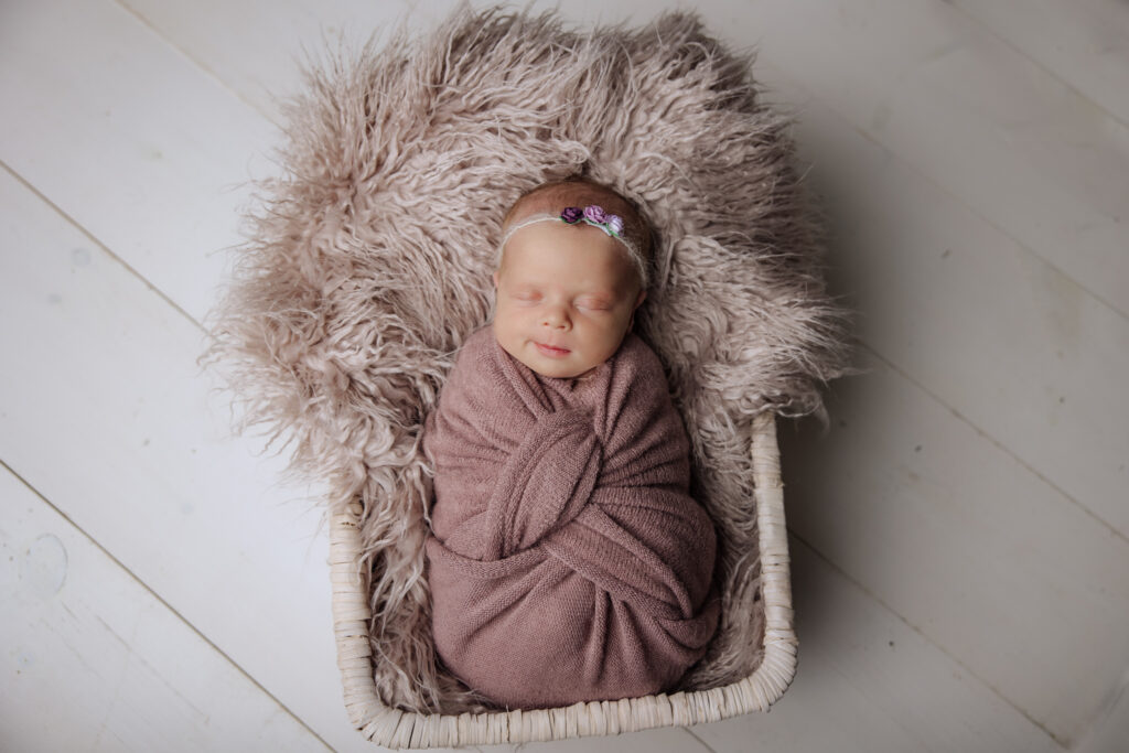 smiling newborn girl in purple and gray | Pittsburgh newborn photographers Kelly Adrienne Photography