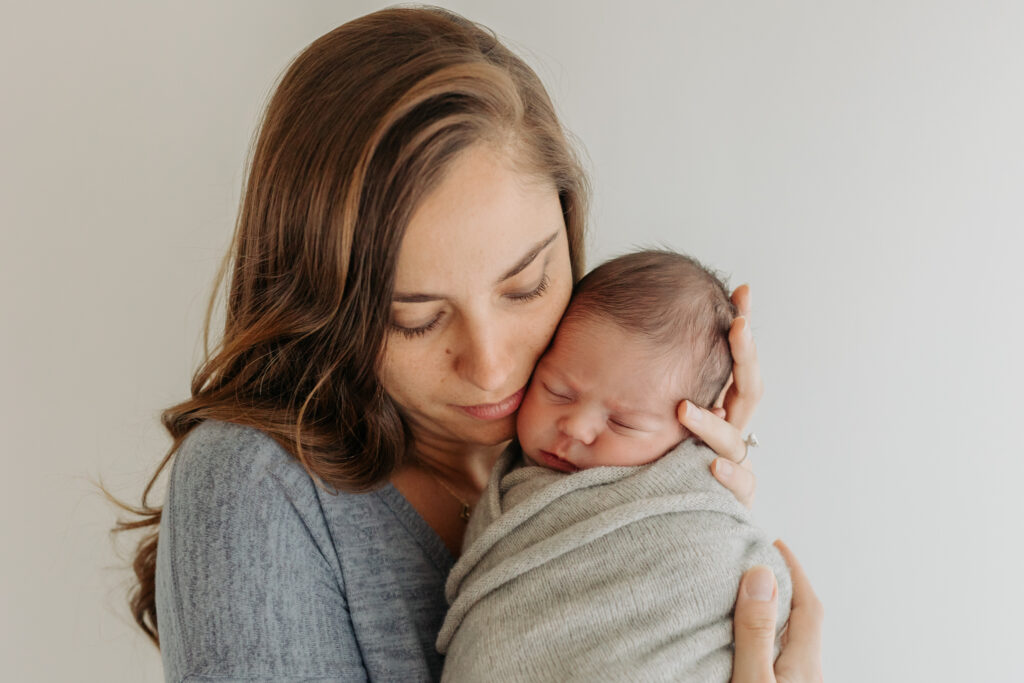 mom and baby at newborn photoshoot | Kelly Adrienne Photography