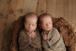 twin sleeping newborn boys in neutral wraps, Kelly Adrienne Photography