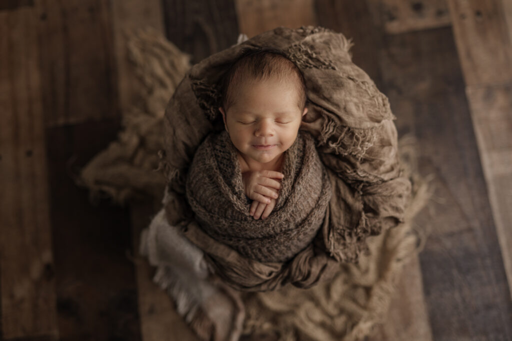 newborn boy smiling in studio | Kelly Adrienne Photography