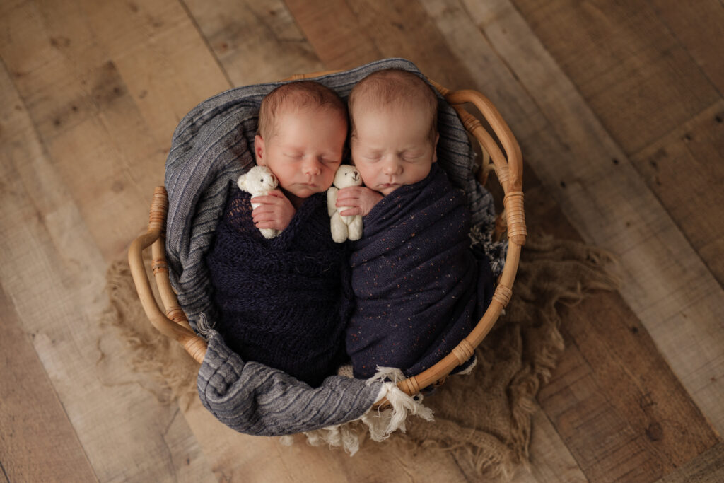 twin newborn boys in matching blue wraps, Kelly Adrienne Photography