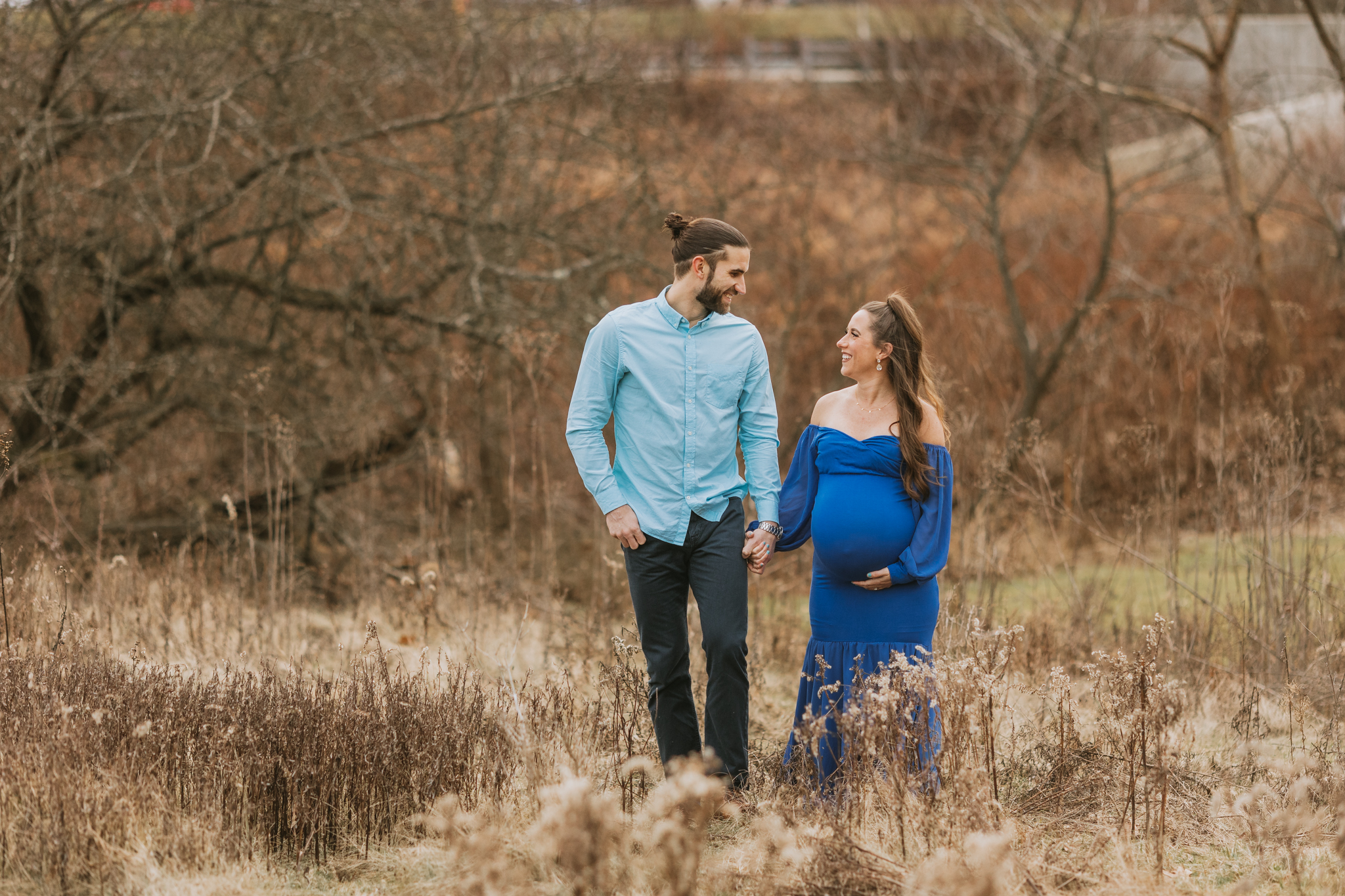 Couple walking at Pittsburgh outdoor field maternity session | Kelly Adrienne Photography