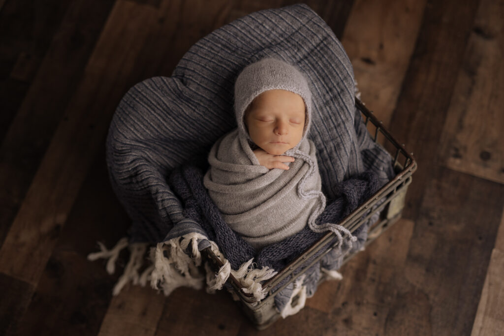 baby photos of boy in metal crate prop at Kelly Adrienne Photography studio