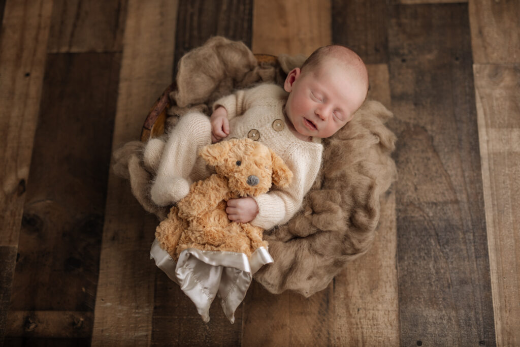 baby holding stuffed dog | Kelly Adrienne Photography