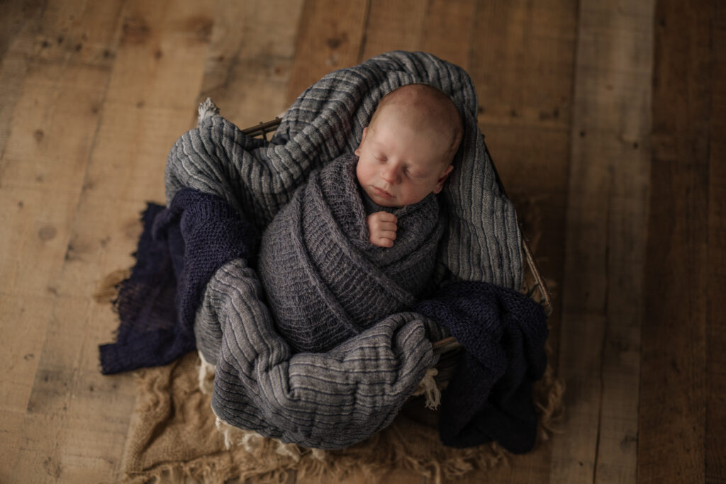 baby wrapped in blue at newborn session | Kelly Adrienne Photography