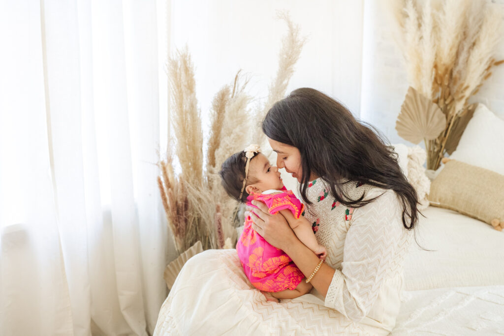 mom snuggling 3-month old baby girl | lifestyle family photography