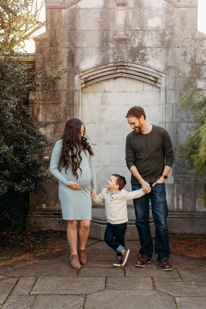 Little boy looking up at mom at maternity session | Kelly Adrienne Photography