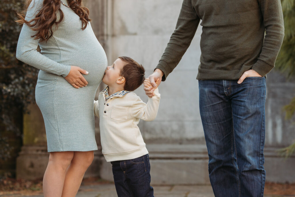 Little boy kissing mom's pregnant belly at maternity session | Kelly Adrienne Photography