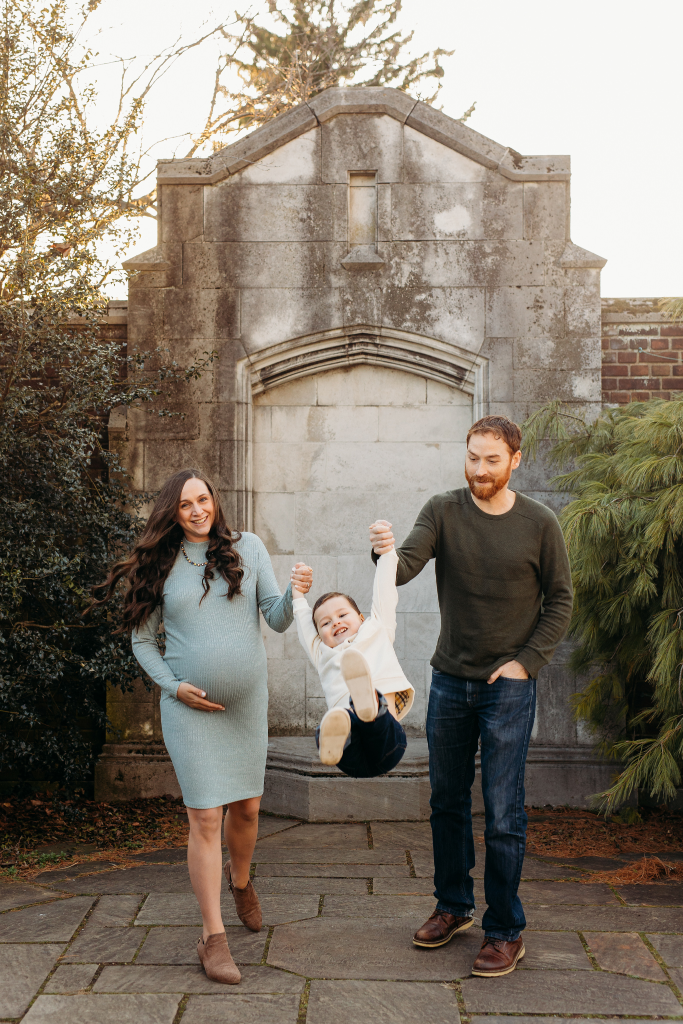 Couple swinging little boy at outdoor maternity session at Mellon Park | Kelly Adrienne Photography
