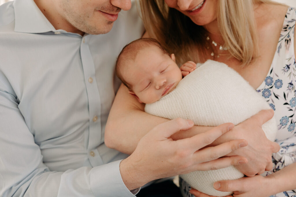 Parents and baby at boho studio newborn session | Kelly Adrienne Photography