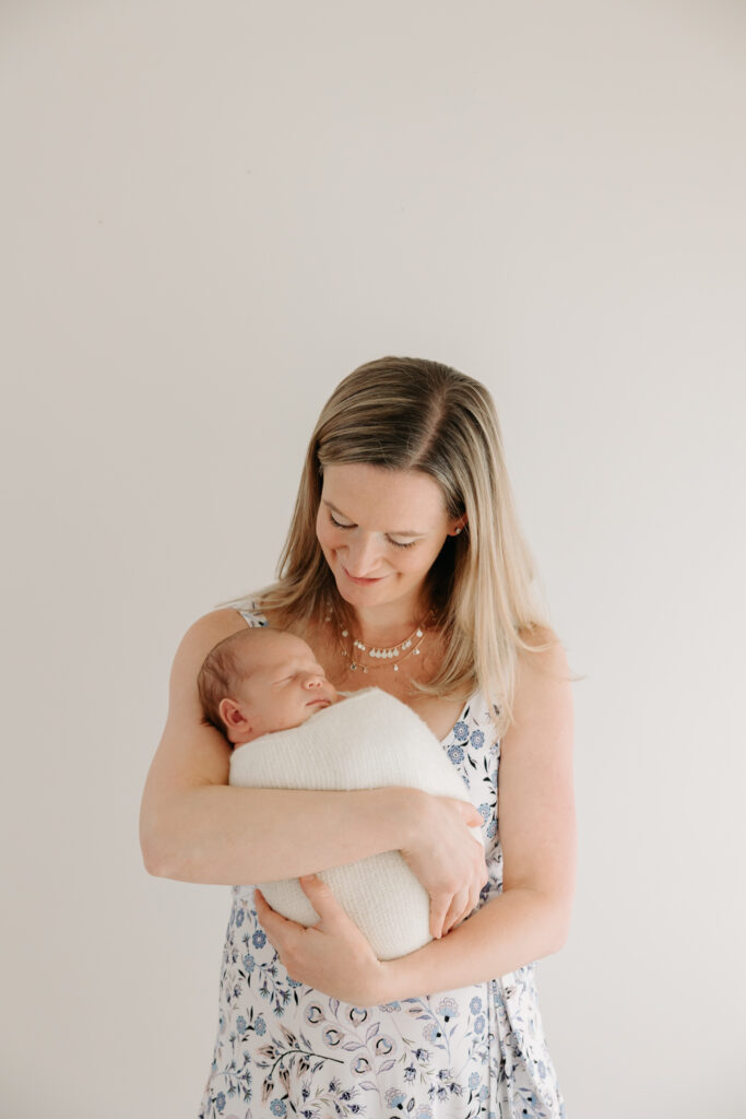 Mom holding baby at studio family photos in Pittsburgh PA | Kelly Adrienne Photography