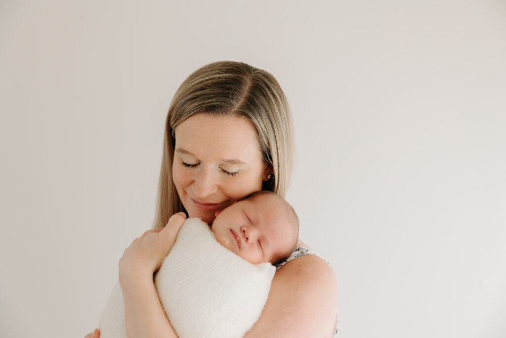Mom holding baby at studio family photos in Pittsburgh PA | Kelly Adrienne Photography