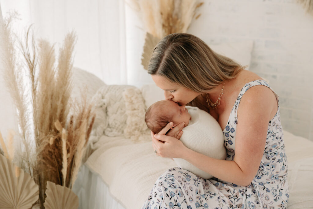 Mom kissing baby at studio family photos in Pittsburgh PA | Kelly Adrienne Photography