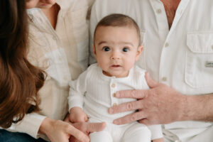 sweet 3-month-old smiles at a boho studio session
