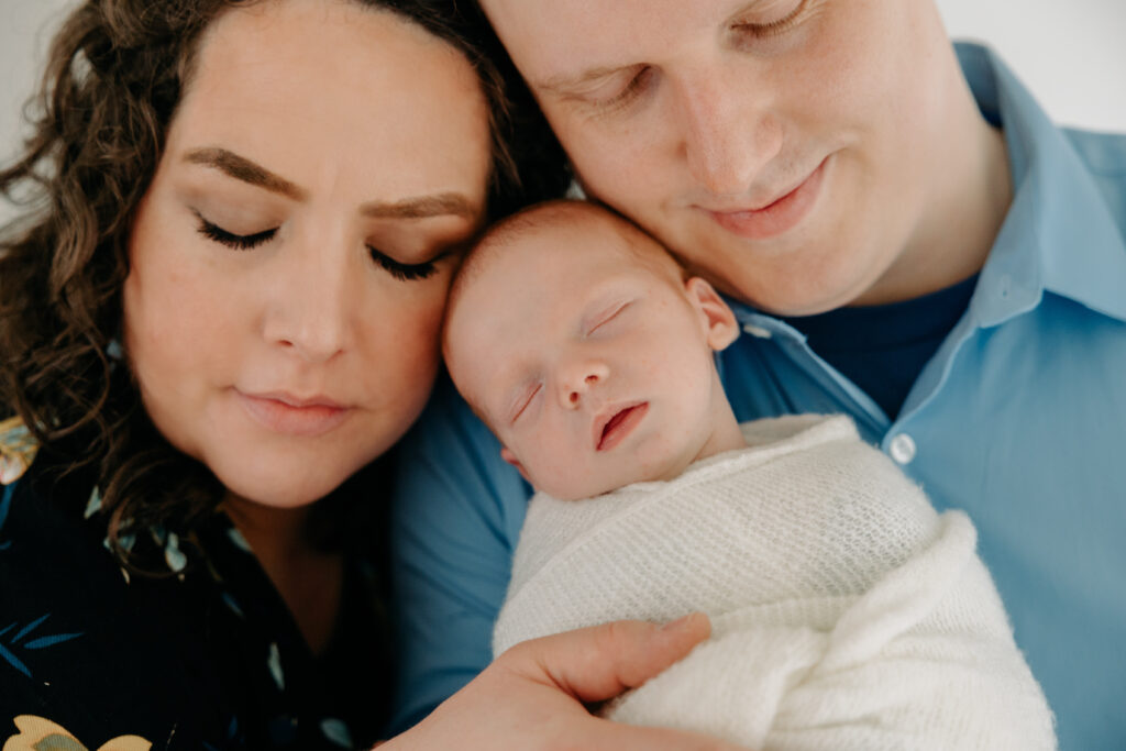 mom and dad snuggle with their newborn baby boy, Wexford, PA