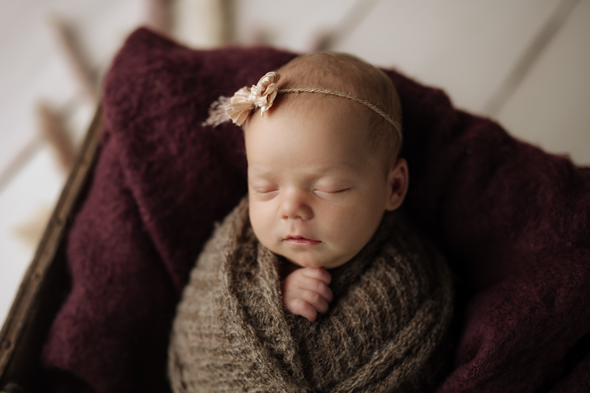 newborn girl in plum and fall colors at newborn photo session in Pittsburgh | Kelly Adrienne Photography