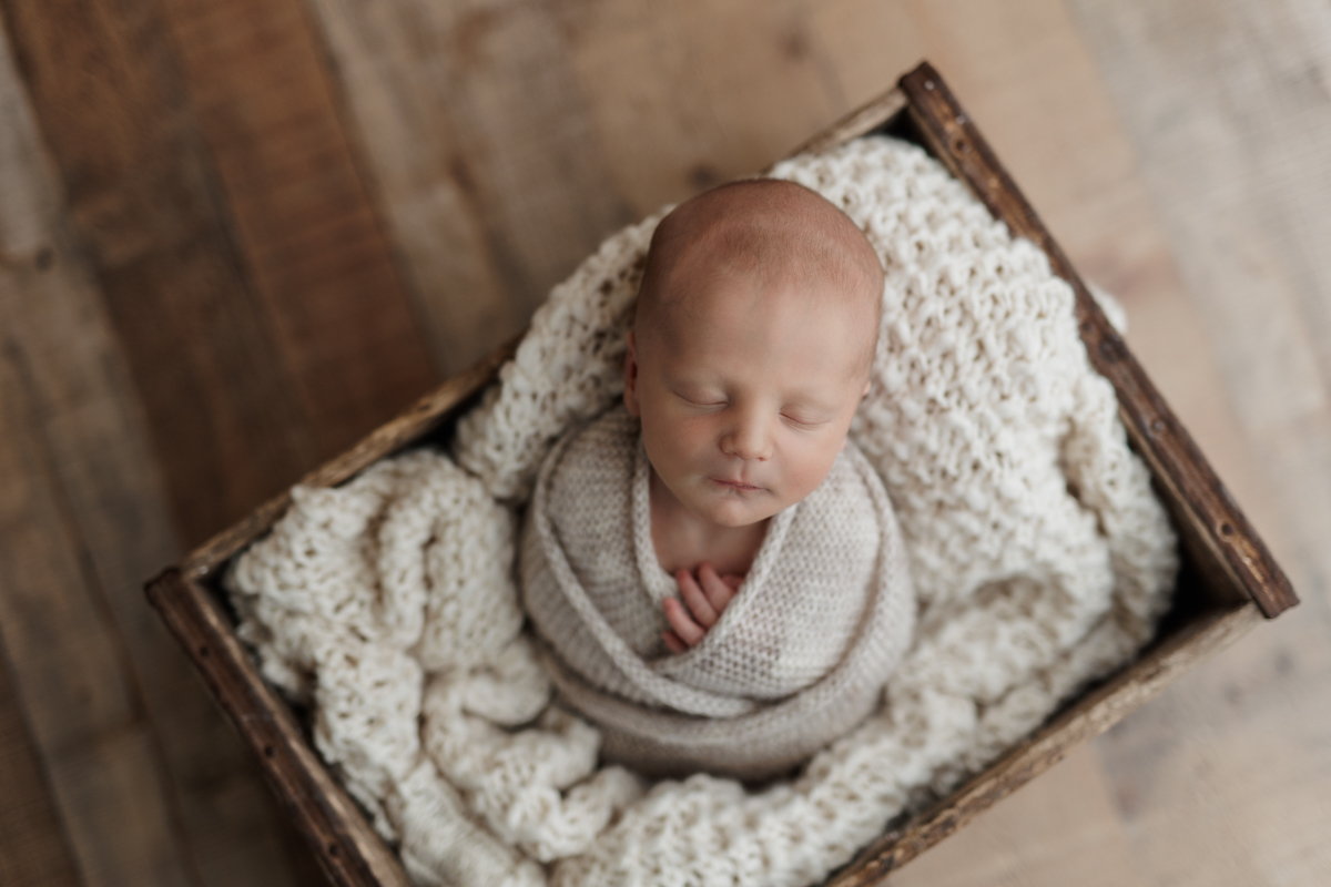 baby boy wrapped in neutrals at Pittsburgh newborn photo shoot