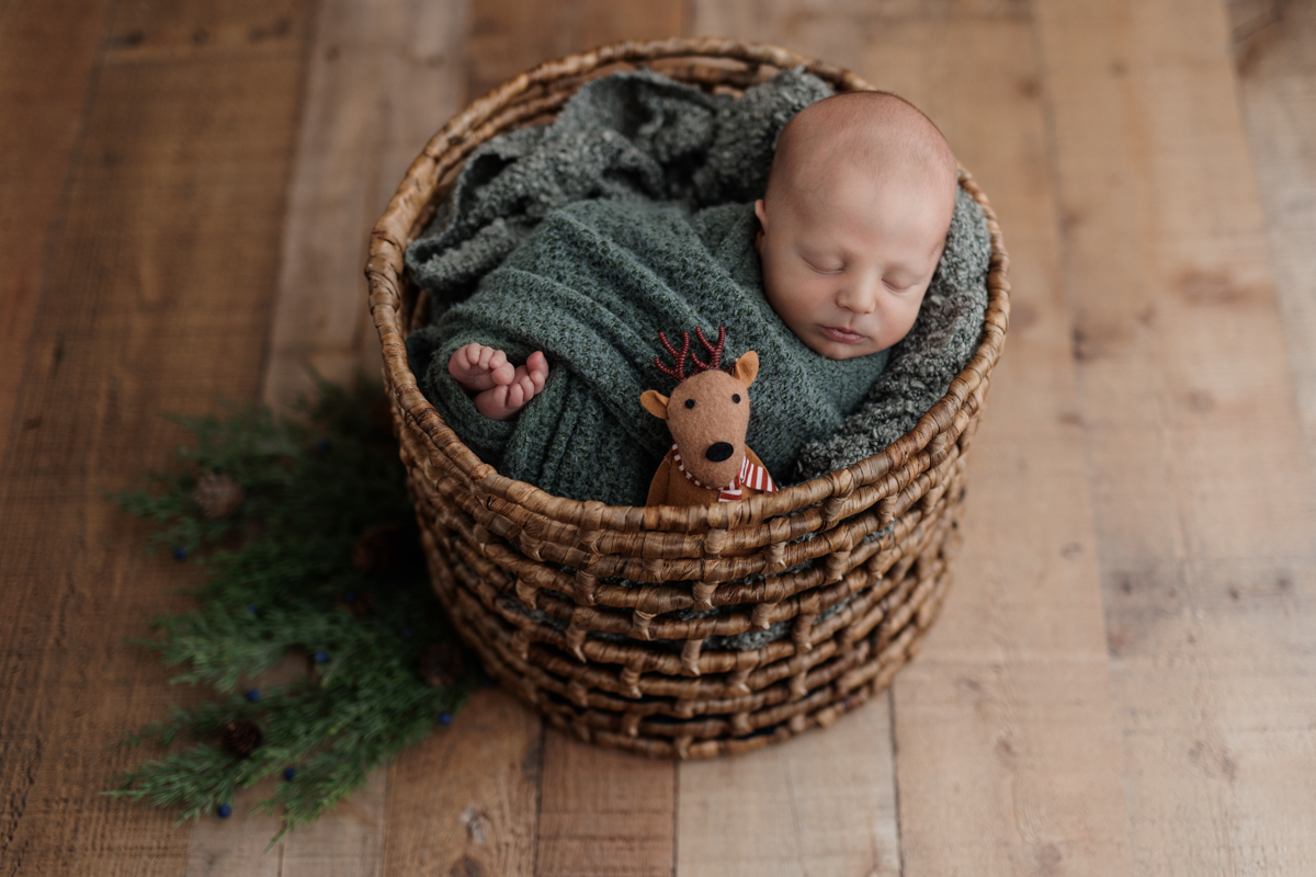 Christmas green newborn prop setup at Pittsburgh photo studio
