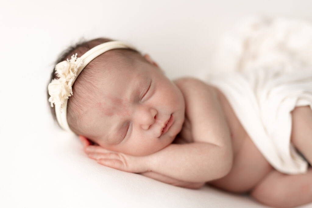 baby girl in all white at studio | Kelly Adrienne Photography