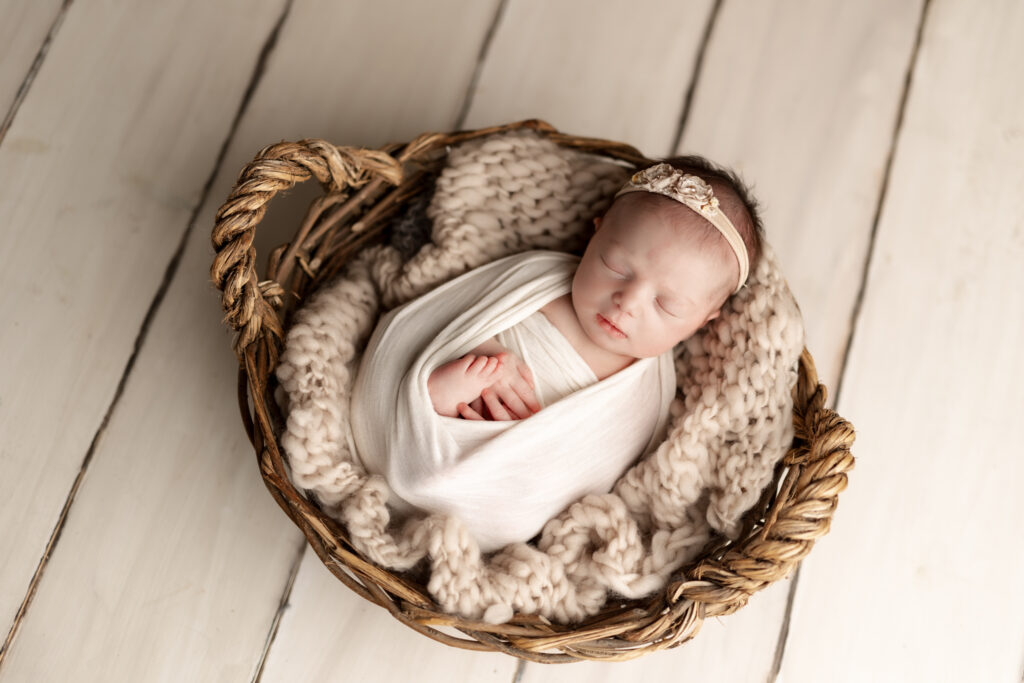 baby in whites and neutrals in basket | Kelly Adrienne Photography