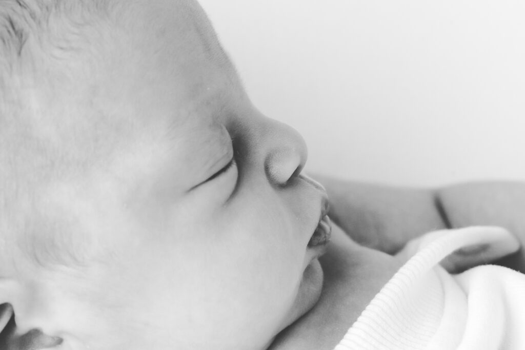 closeup newborn profile in black and white | Kelly Adrienne Photography