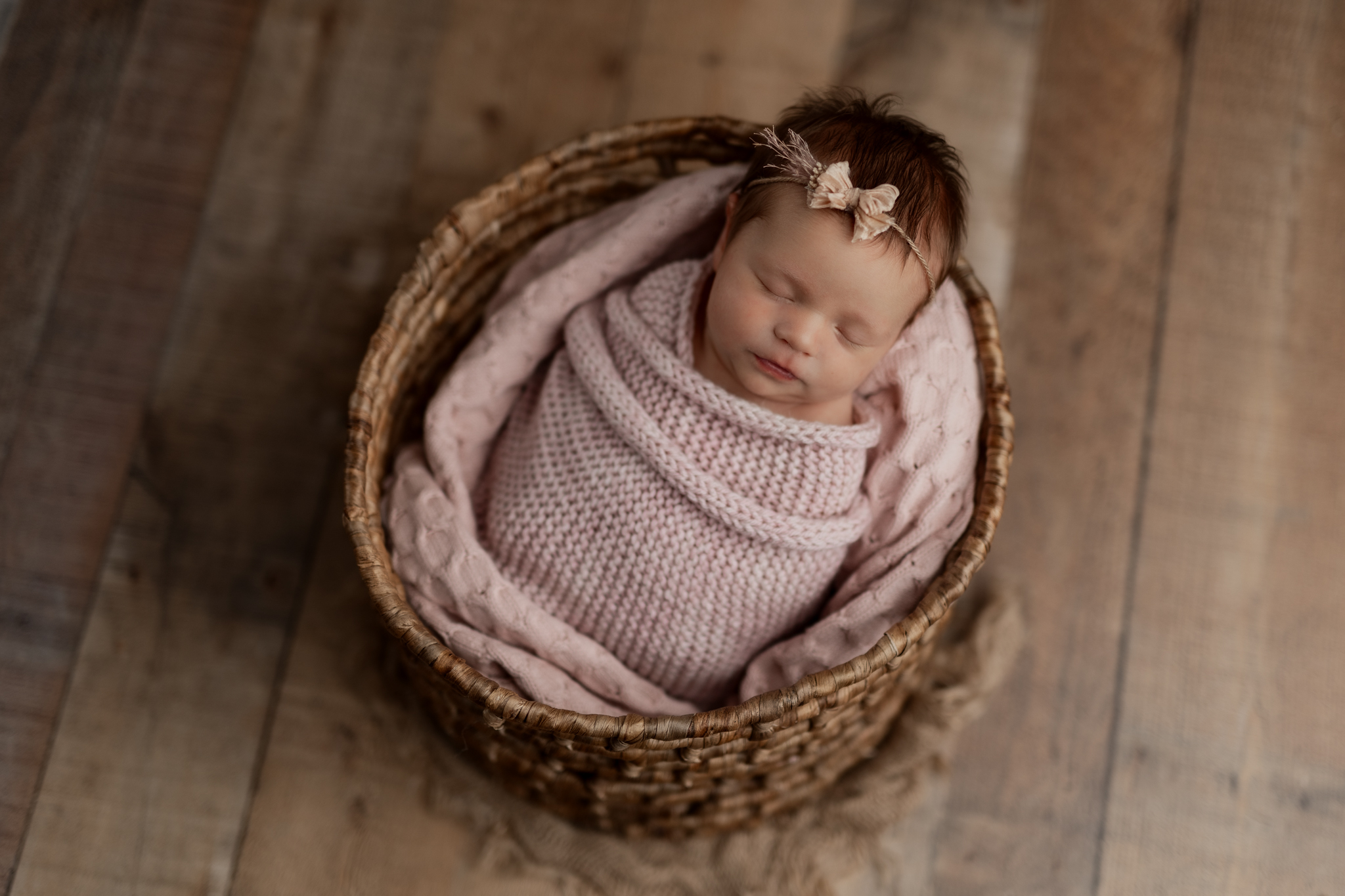 newborn girl in pink at her baby photo shoot in Pittsburgh PA