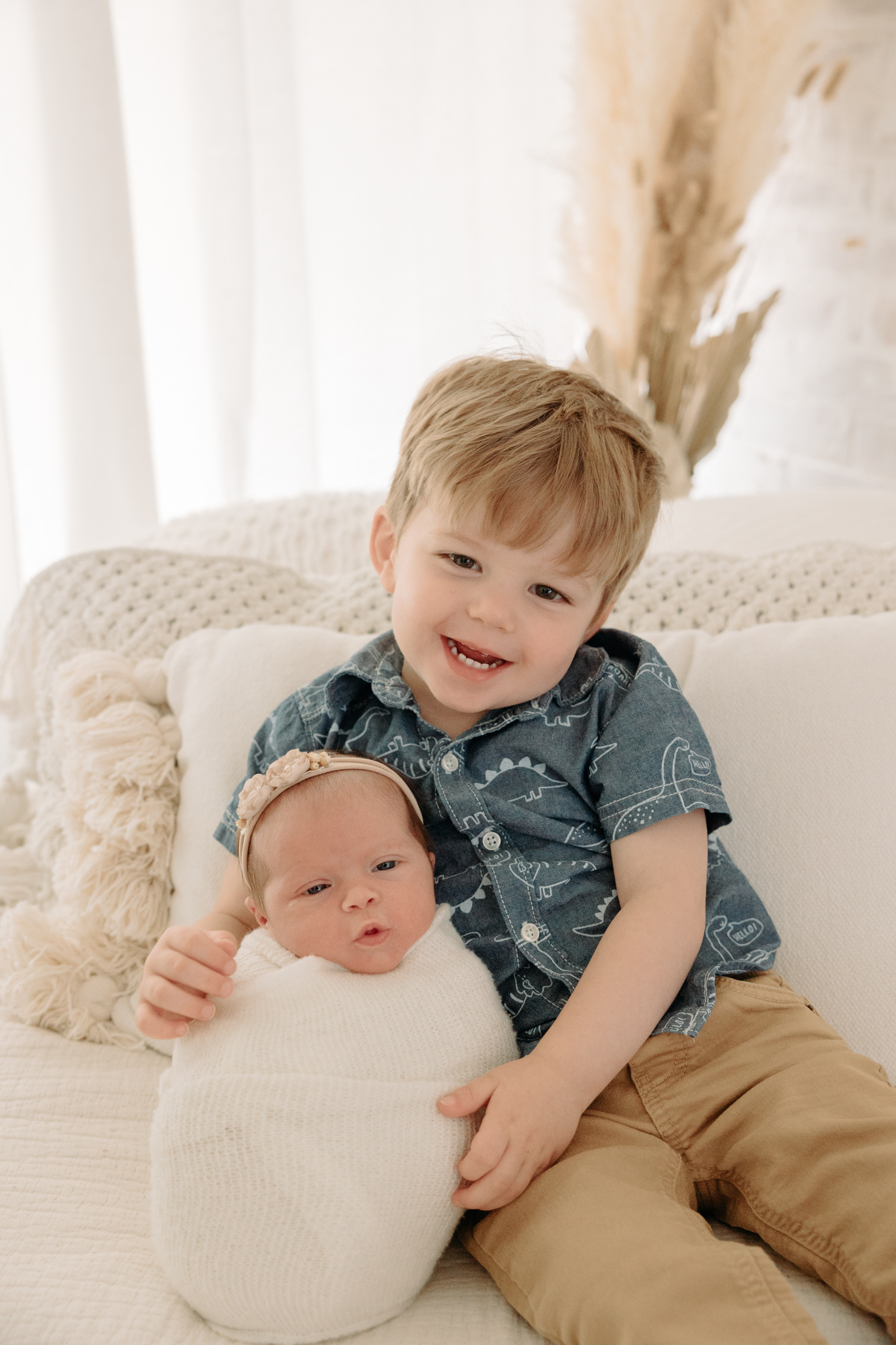 big brother holding newborn sister | Kelly Adrienne Photography