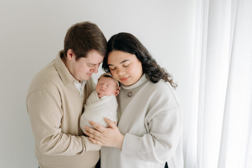 Neutral clothing on a couple at their newborn session | what to wear